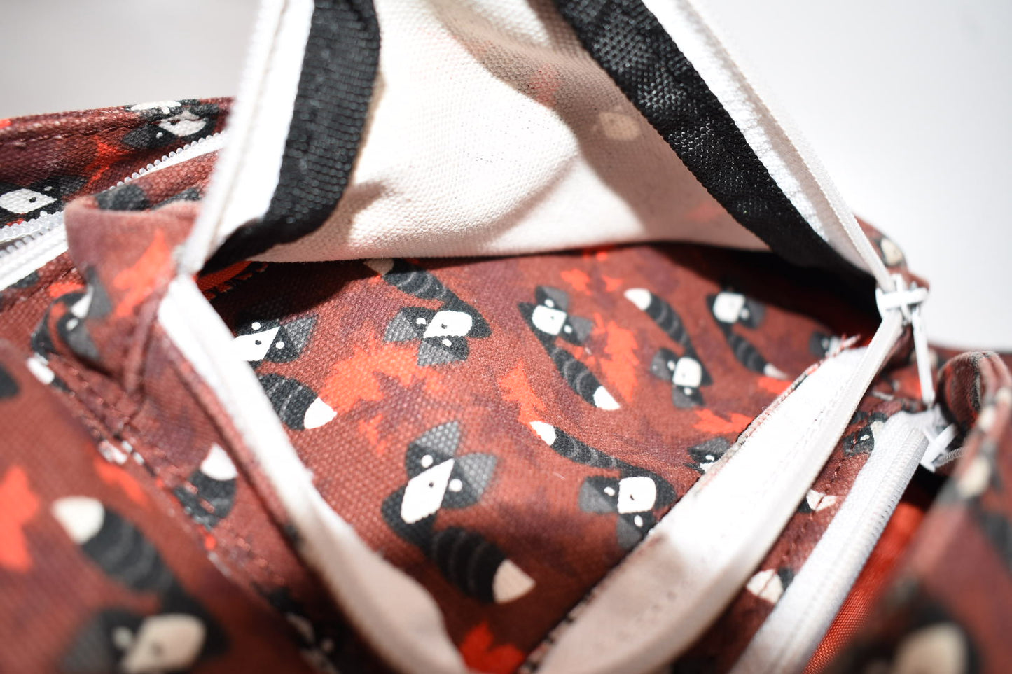 Kavu Rope Sling Bag in Red Critters Racoon