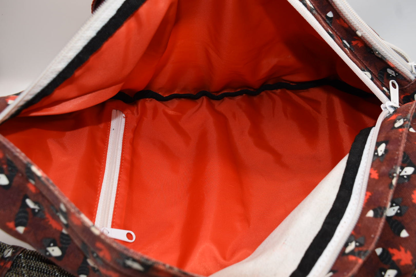 Kavu Rope Sling Bag in Red Critters Racoon