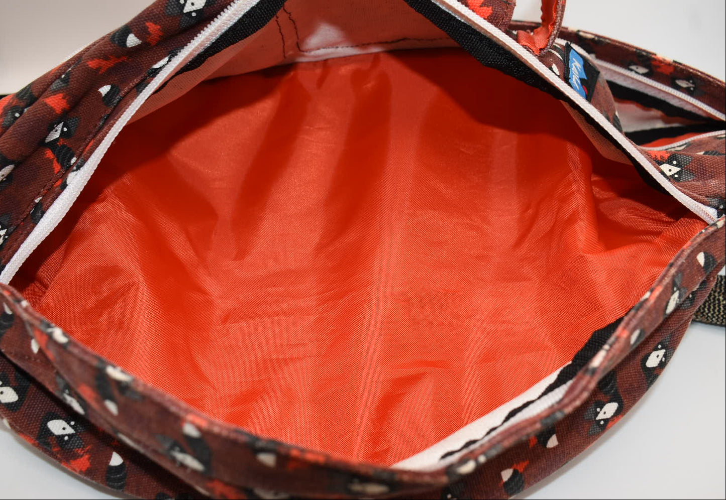 Kavu Rope Sling Bag in Red Critters Racoon