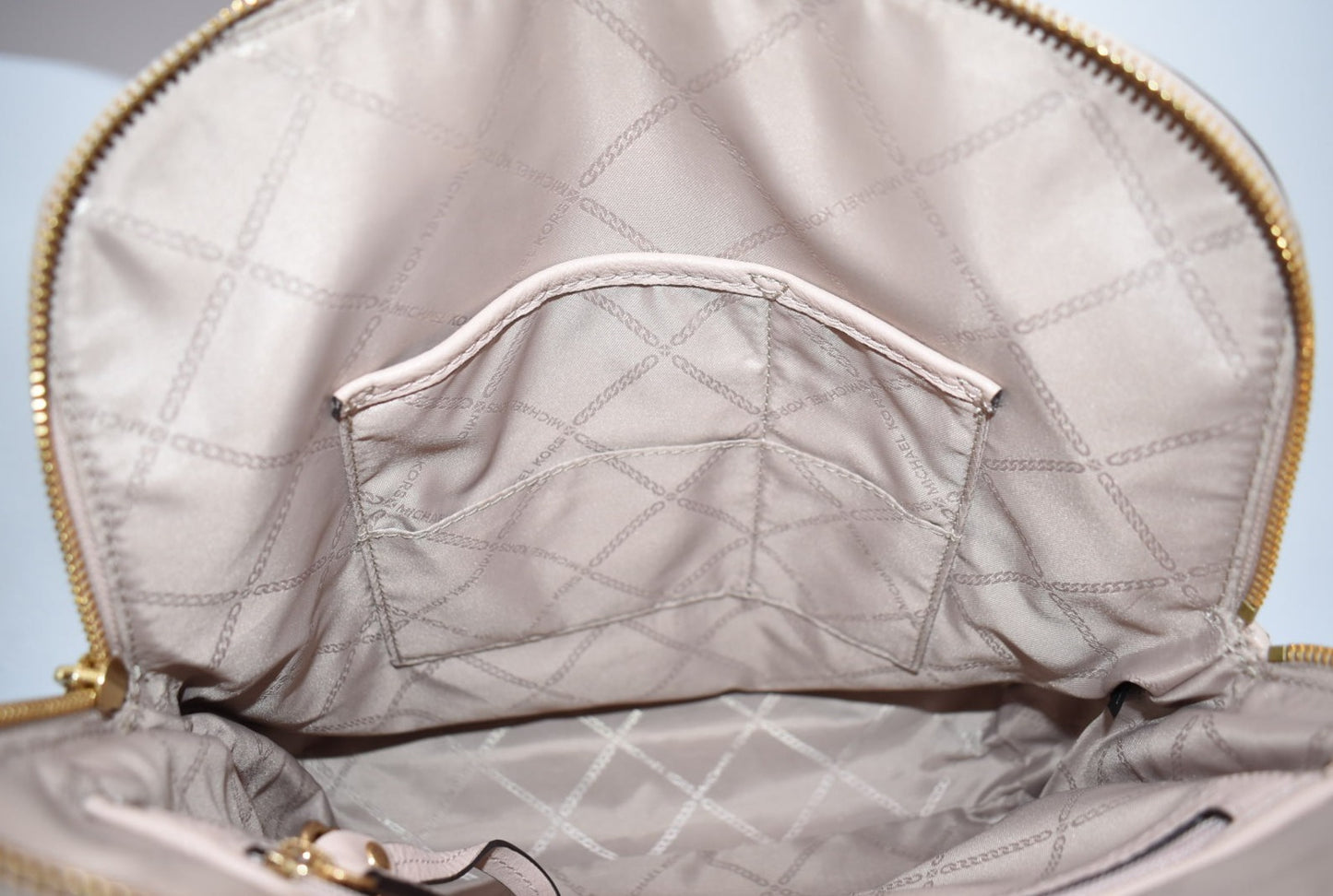 Michael Kors Pebbled Leather Rhea Medium Slim Backpack in Baby Pink
