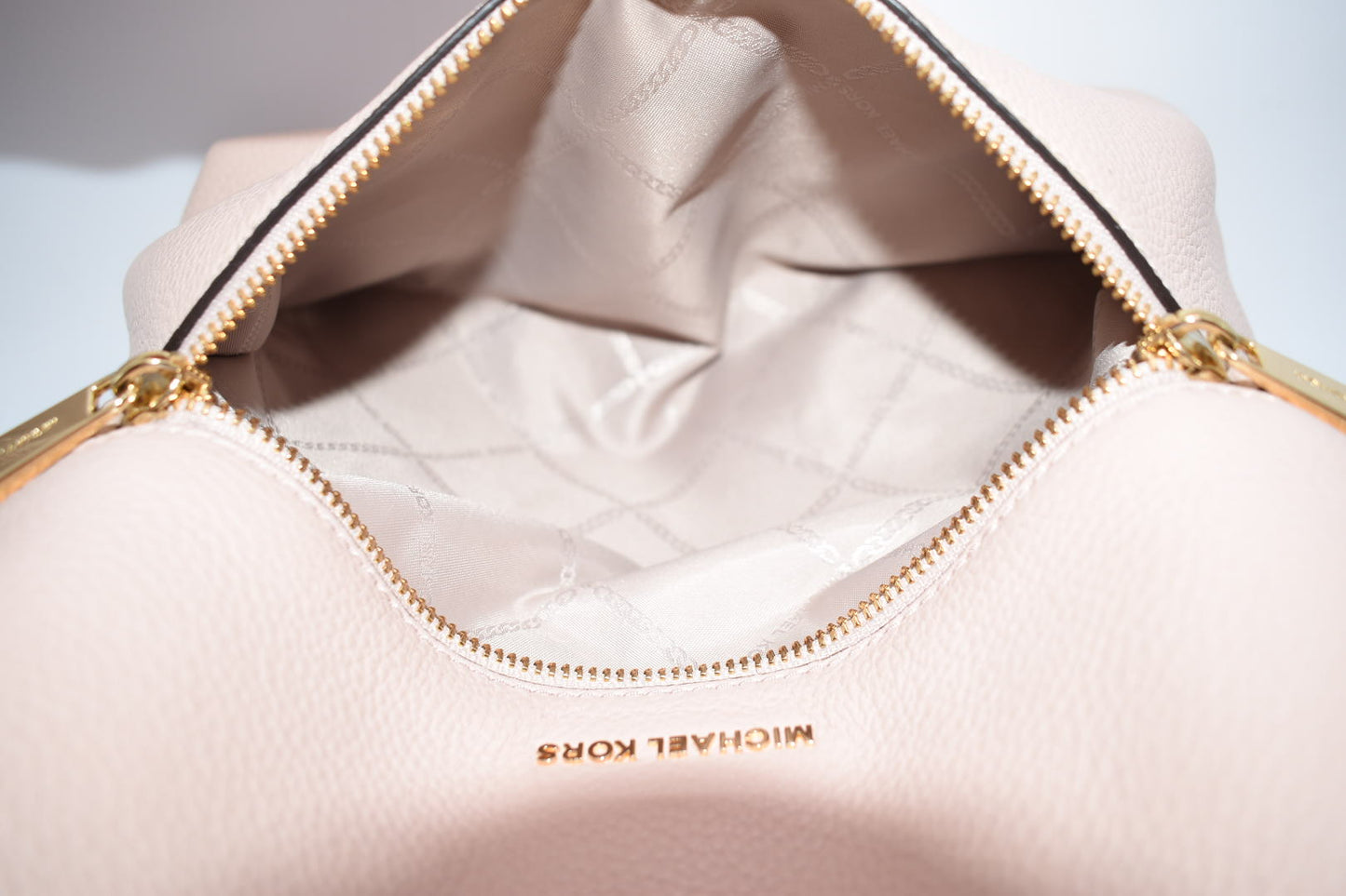 Michael Kors Pebbled Leather Rhea Medium Slim Backpack in Baby Pink