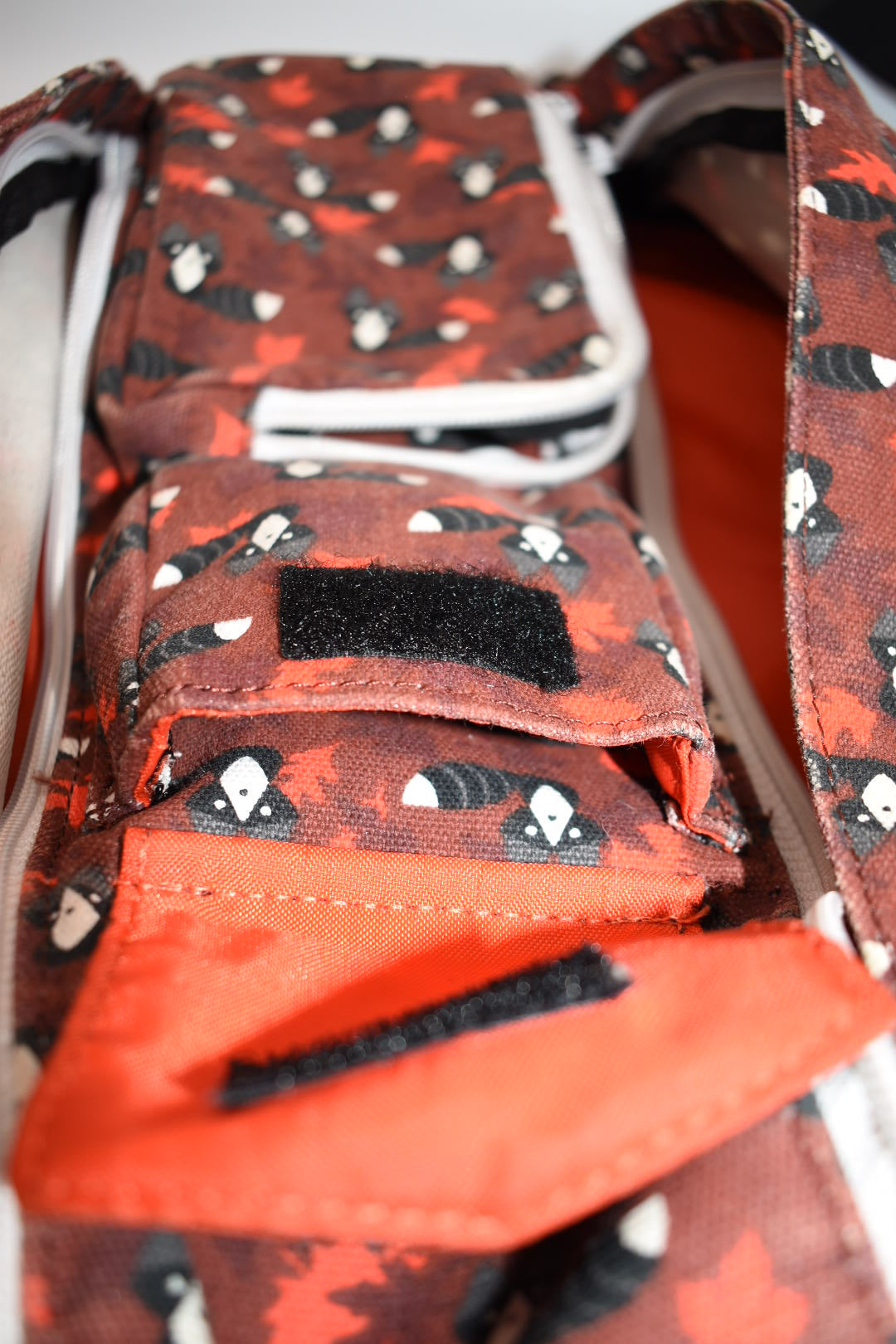 Kavu Rope Sling Bag in Red Critters Racoon